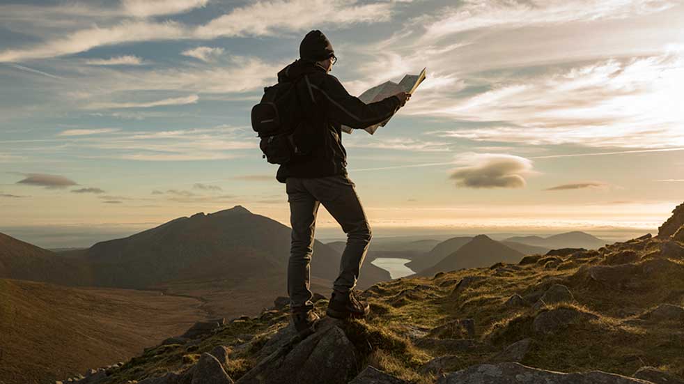 Best autumn walks in the UK man standing on Mourne Mountains